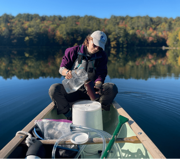 Silas collects water samples.